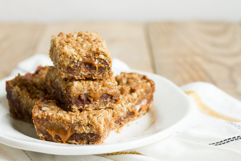 Carmelitas have a buttery oatmeal cookie base and topping, and a luscious chocolate and caramel filling.