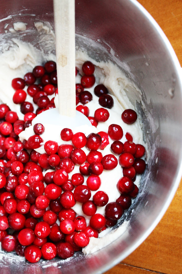 This fresh cranberry cake is beautiful and delicious, a unique dessert to serve during the holidays. Don't skimp on the hot butter sauce: it's the best part!