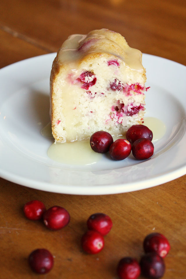 This fresh cranberry cake is beautiful and delicious, a unique dessert to serve during the holidays. Don't skimp on the hot butter sauce: it's the best part!