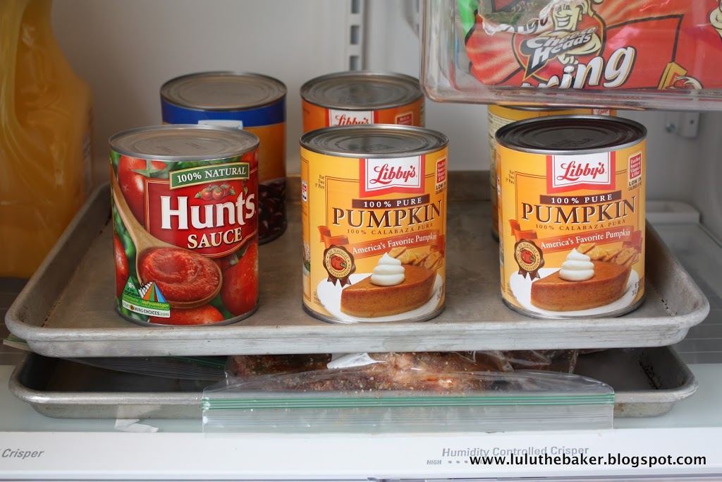 Pressing homemade corned beef during the curing process.