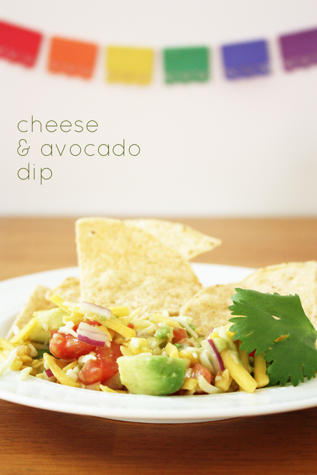 This super fresh tex-mex dip is unlike anything else I've ever had. Fresh avocado, red onion, and tomatoes combine with shredded cheese and a hint of green taco sauce to make a delicious dip.