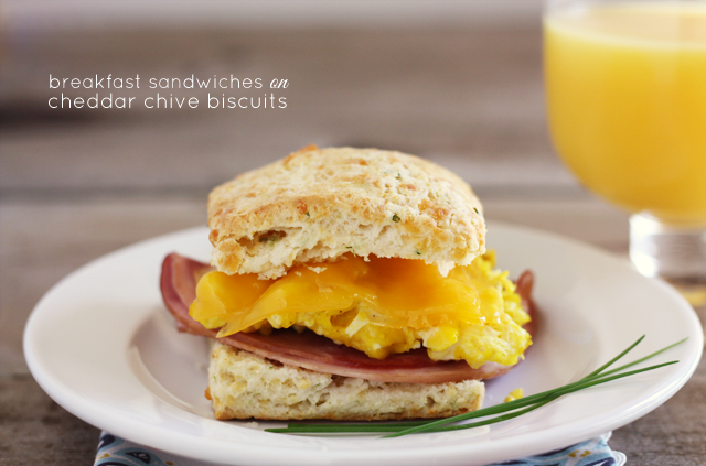 These ham, egg, and cheese breakfast sandwiches on cheddar chive biscuits are just as delicious for dinner as they are for breakfast!