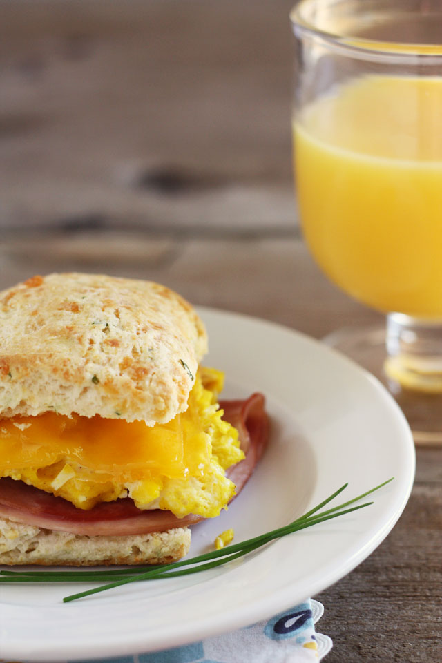 These ham, egg, and cheese breakfast sandwiches on cheddar chive biscuits are just as delicious for dinner as they are for breakfast!