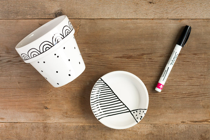 Need a cute, quick, last-minute gift? Customize a simple, glazed flower pot with paint markers for a fun and fast gift.