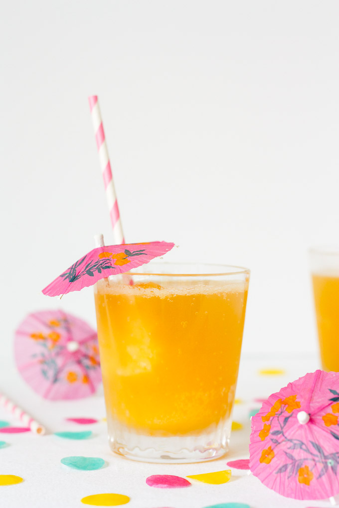A mixture of pineapple, banana, and orange is frozen, cut into ice cubes, and topped with your favorite fizzy drink in this family-friendly, retro Tropical Party Slush.