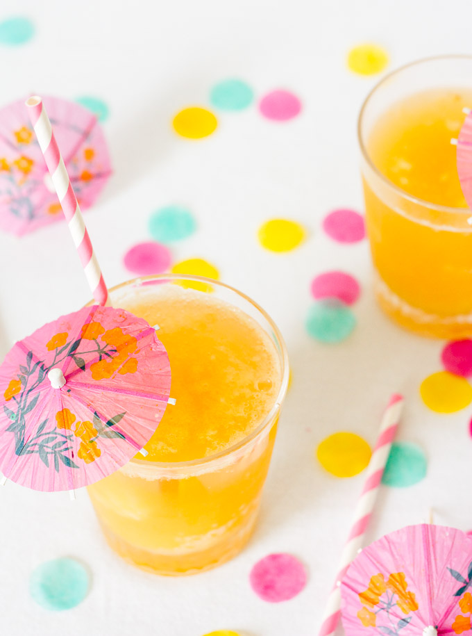 A mixture of pineapple, banana, and orange is frozen, cut into ice cubes, and topped with your favorite fizzy drink in this family-friendly, retro Tropical Party Slush.