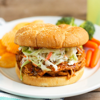 These barbecue chicken sandwiches are served on a buttered, griddled bun, and topped with creamy, homemade cole slaw. You'll want to eat them every week!