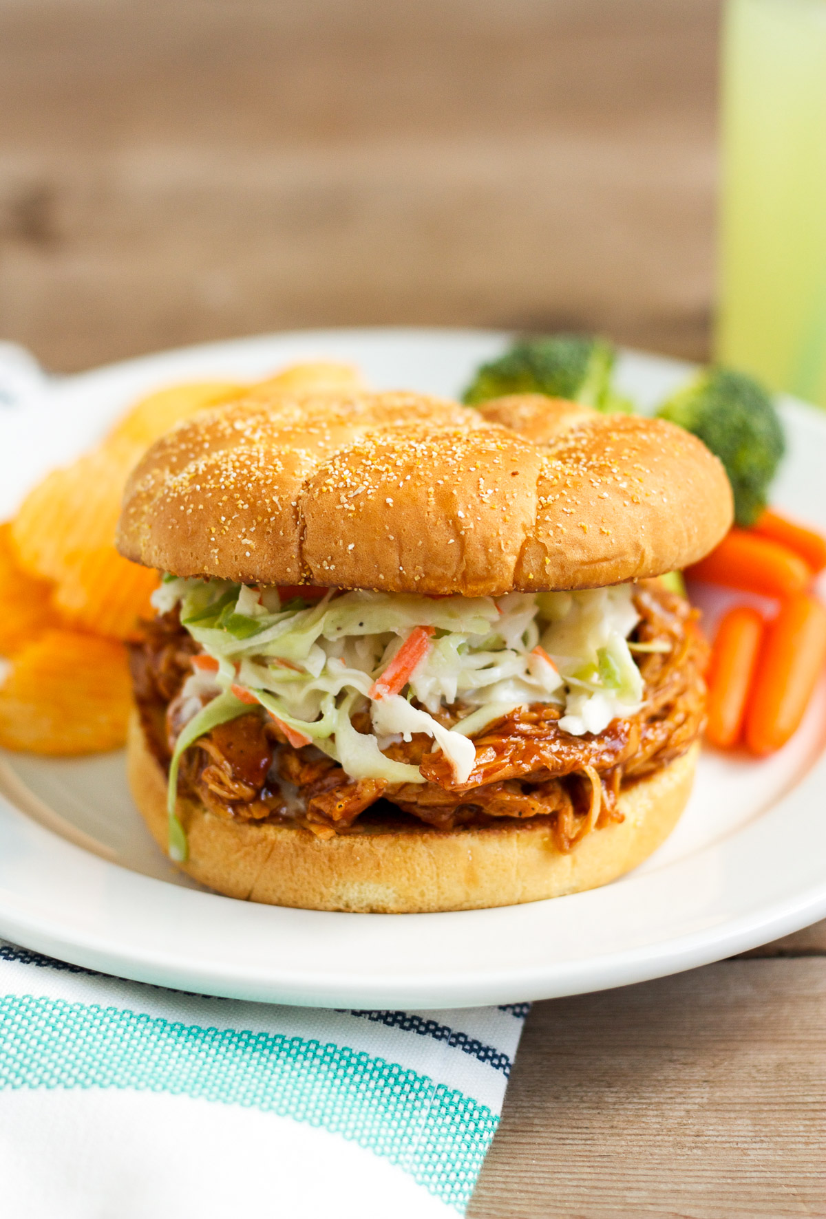 These barbecue chicken sandwiches are served on a buttered, griddled bun, and topped with creamy, homemade cole slaw. You'll want to eat them every week!