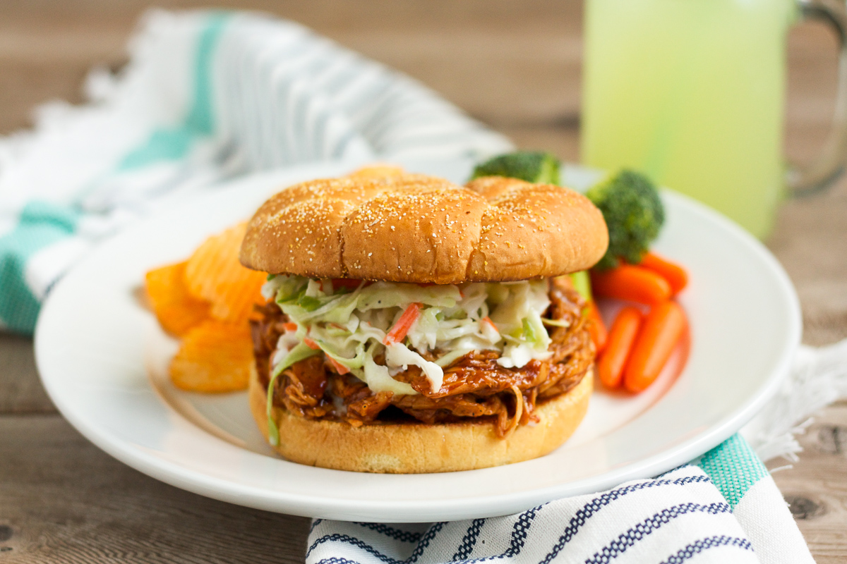 These barbecue chicken sandwiches are served on a buttered, griddled bun, and topped with creamy, homemade cole slaw. You'll want to eat them every week!