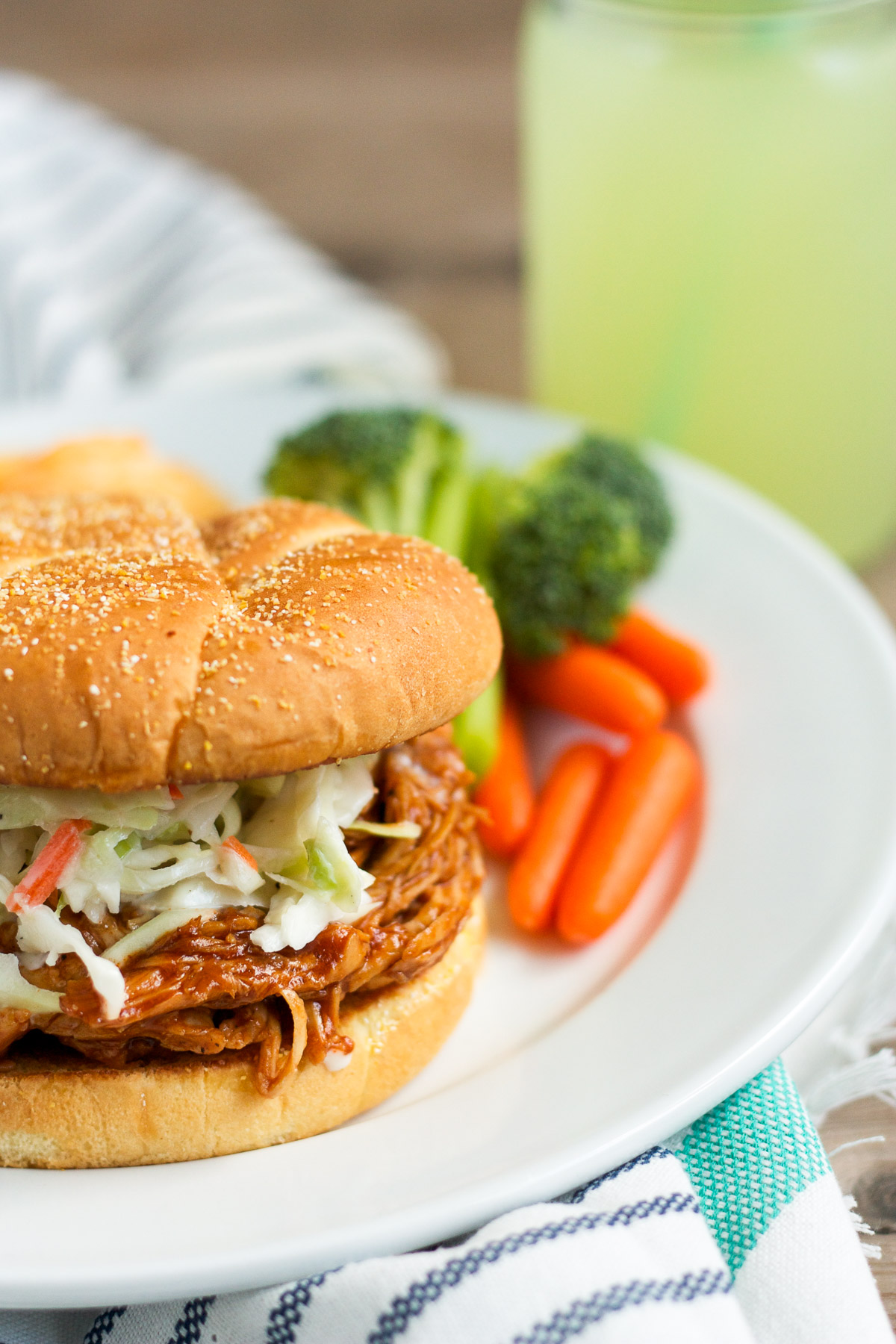 These barbecue chicken sandwiches are served on a buttered, griddled bun, and topped with creamy, homemade cole slaw. You'll want to eat them every week!