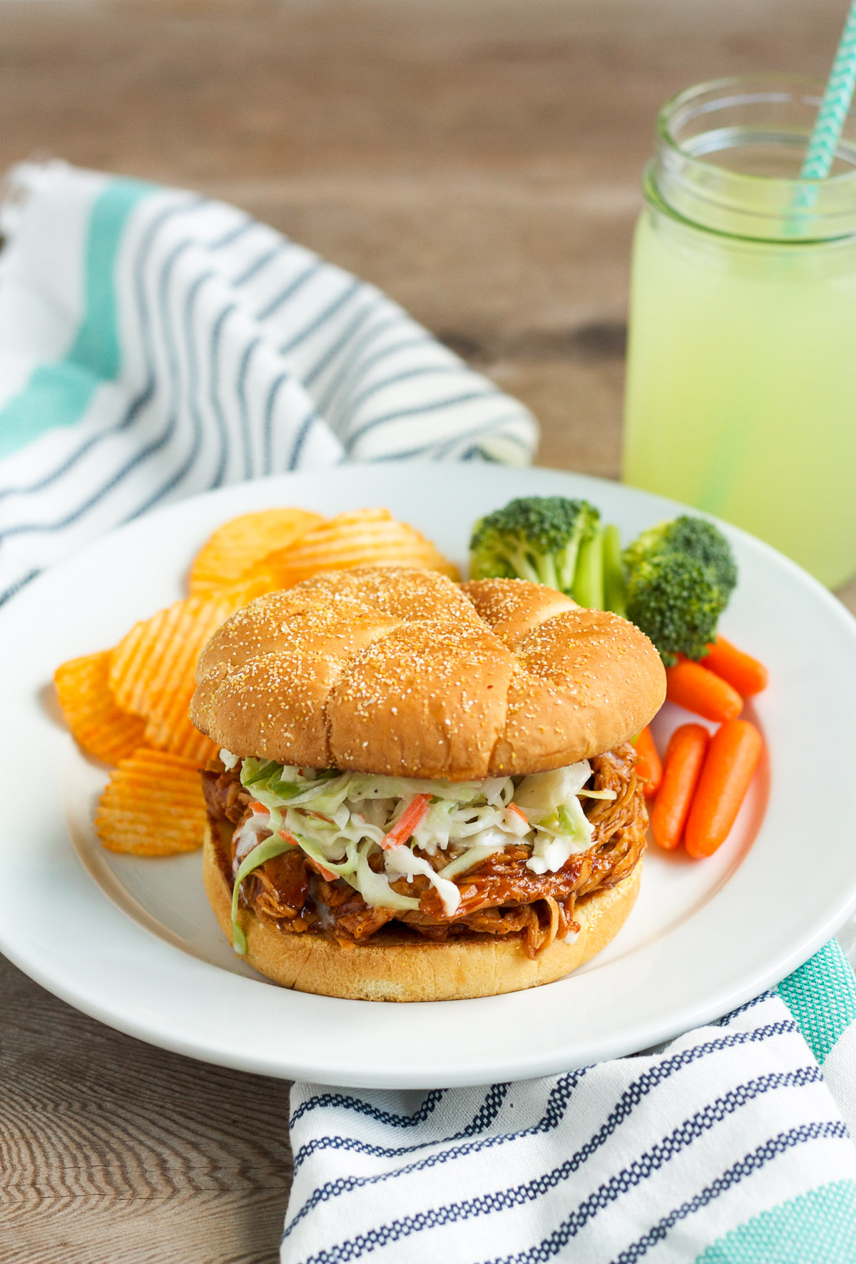 These barbecue chicken sandwiches are served on a buttered, griddled bun, and topped with creamy, homemade cole slaw. You'll want to eat them every week!