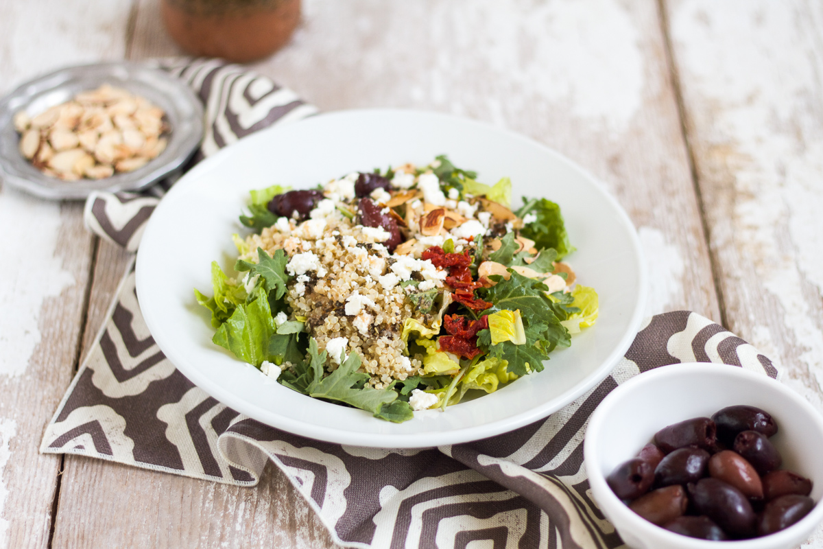 This Mediterranean Salad with Kale & Quinoa tastes just like the one served at Panera Bread. It's easy to make at home and is full of good-for-you ingredients like kale, quinoa, and almonds.