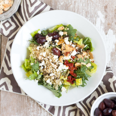 This Mediterranean Salad with Kale & Quinoa tastes just like the one served at Panera Bread. It's easy to make at home and is full of good-for-you ingredients like kale, quinoa, and almonds.