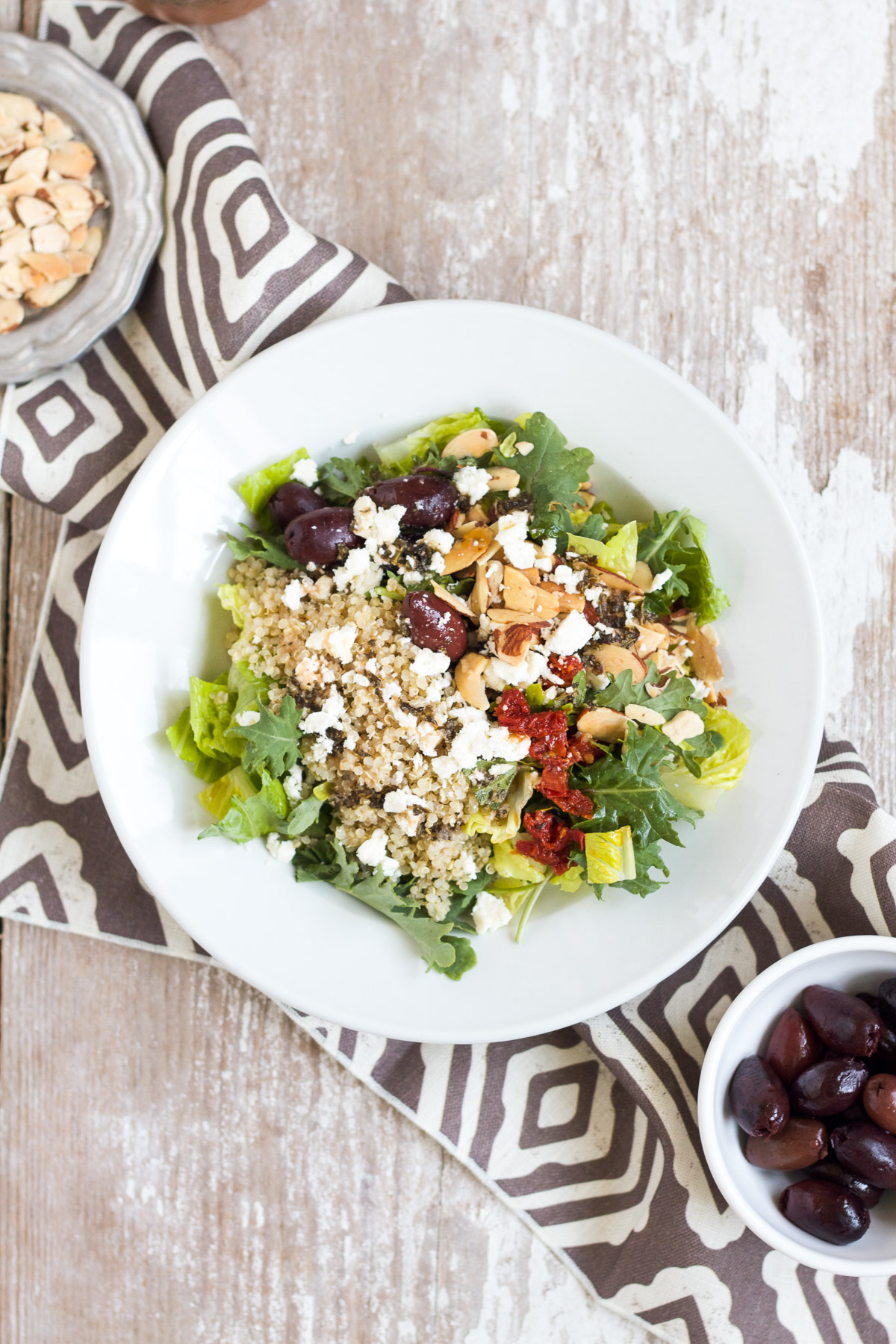 This Mediterranean Salad with Kale & Quinoa tastes just like the one served at Panera Bread. It's easy to make at home and is full of good-for-you ingredients like kale, quinoa, and almonds.