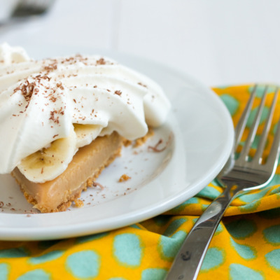Banoffee Pie starts with a buttery, graham cracker crust filled with an easy-to-make, sticky stove top caramel. Add some banana slices and a pile of whipped cream, and you've got yourself one amazing dessert!