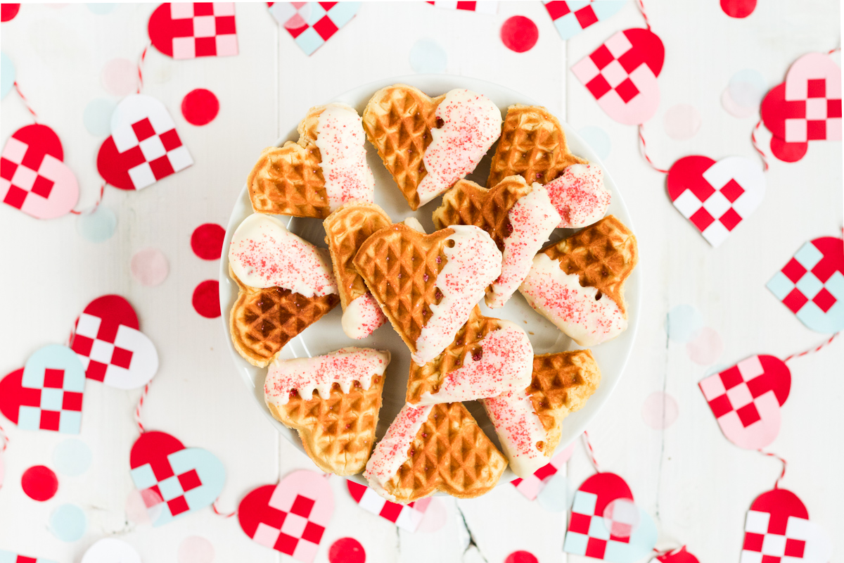 Heart-shaped waffle cookies dipped in white chocolate