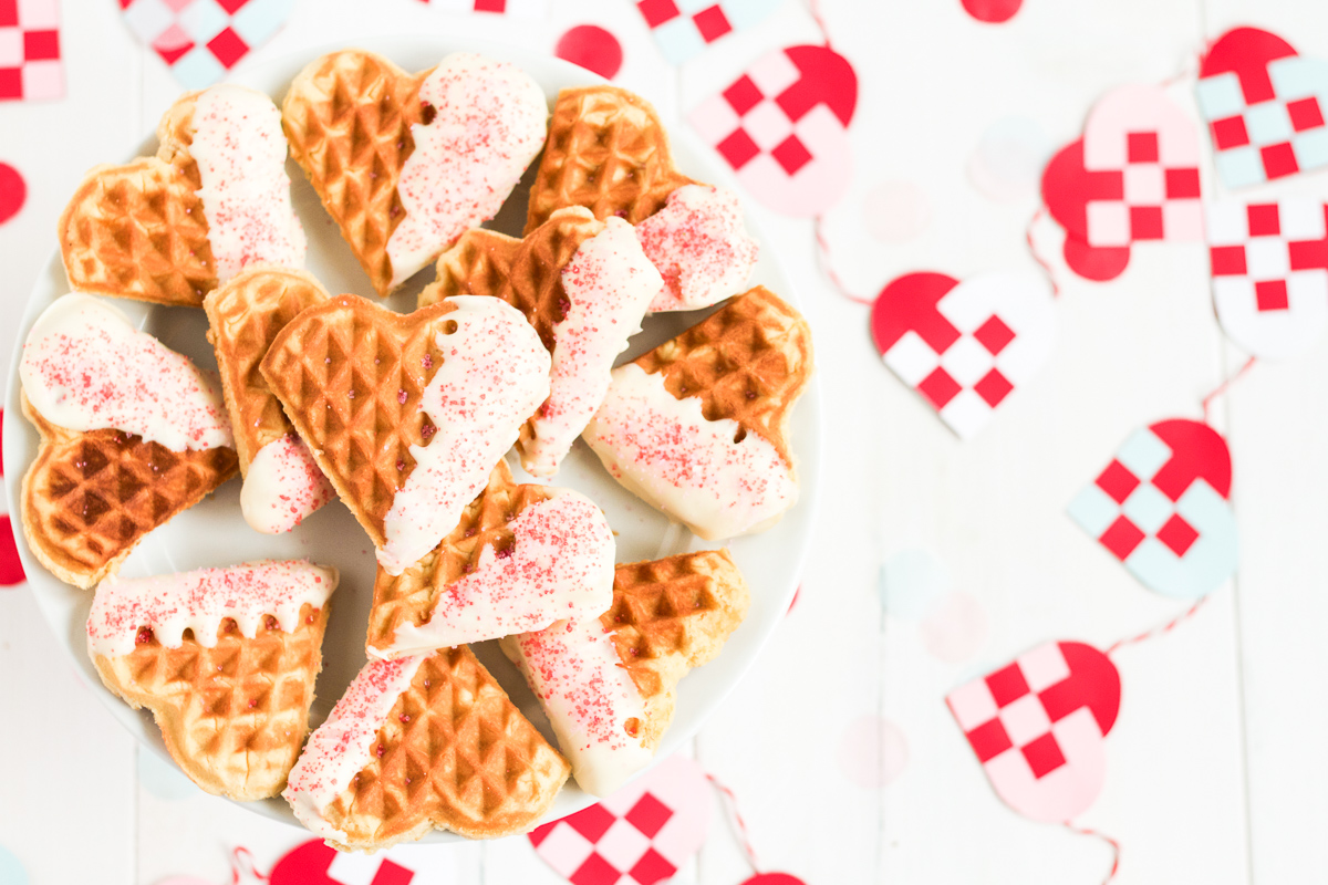 Heart-shaped waffle cookies dipped in white chocolate