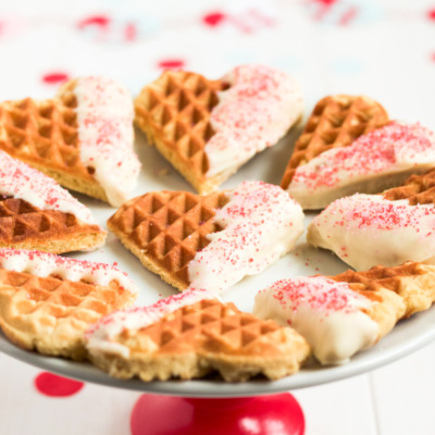 Heart-shaped waffle cookies dipped in white chocolate