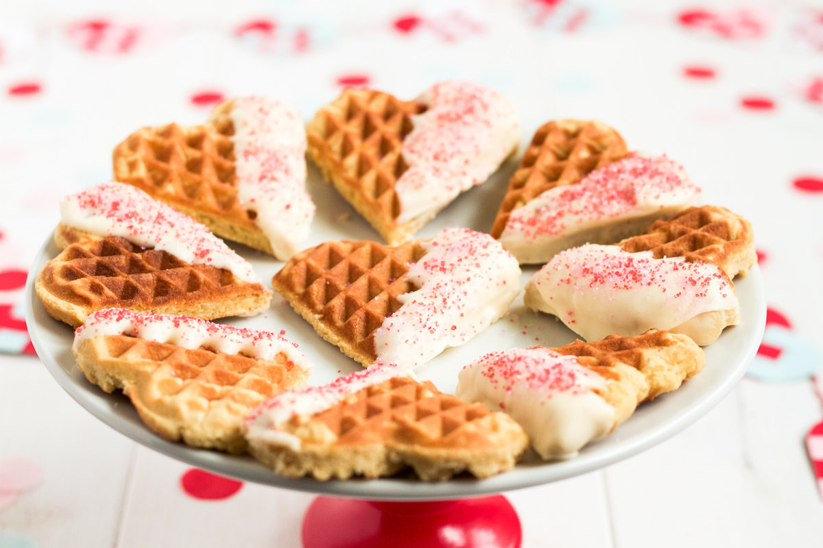 Heart-shaped waffle cookies dipped in white chocolate