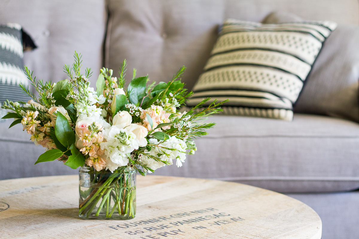 White and peach flowers for a naturalist living room makeover.