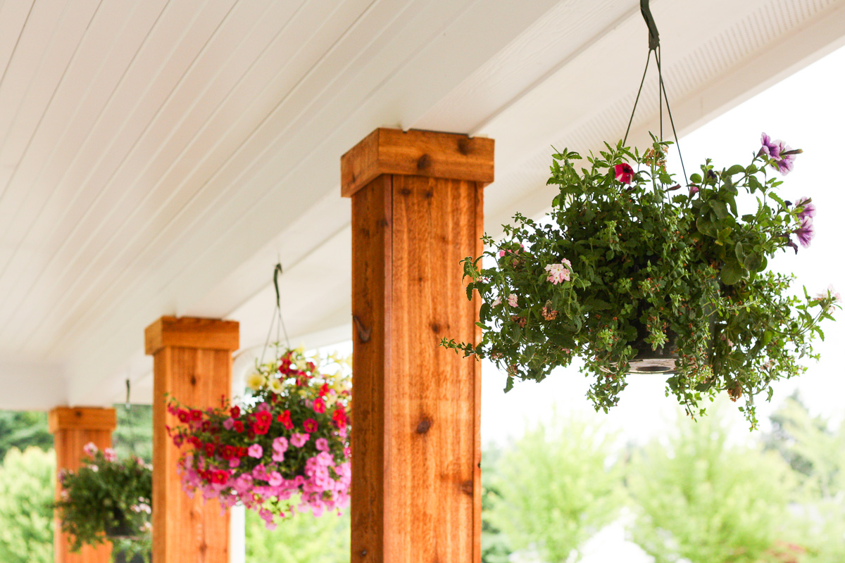 We turned the plain white front porch pillars into cedar pillars, and our porch has never looked better.