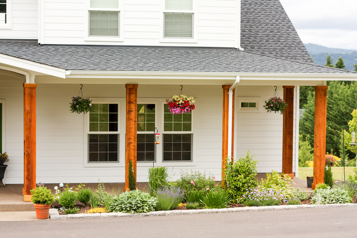 We turned the plain white front porch pillars into cedar pillars, and our porch has never looked better.