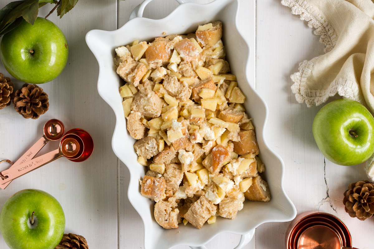 A perfect holiday breakfast for the whole family! This easy stuffed french toast casserole is filled with cinnamon, apples, cream cheese, and chunks of crusty french bread soaked in a sweet, cinnamon-custard sauce. Let it sit in the fridge overnight, then pop it in the oven when you wake up. It will fill your whole house with mouthwatering apple-cinnamon smells while it bakes, and will make tummies happy with every maple syrup-covered bite. For big families or breakfast guests, just double the recipe and bake it in a 9x13" pan.