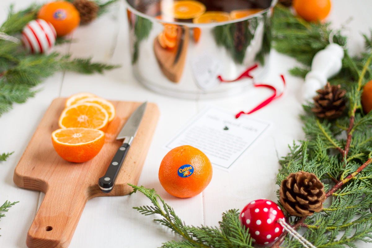 These easy spiced cider with cinnamon, cloves, and cuties is a perfect gift to put together for friends, neighbors, and teachers!