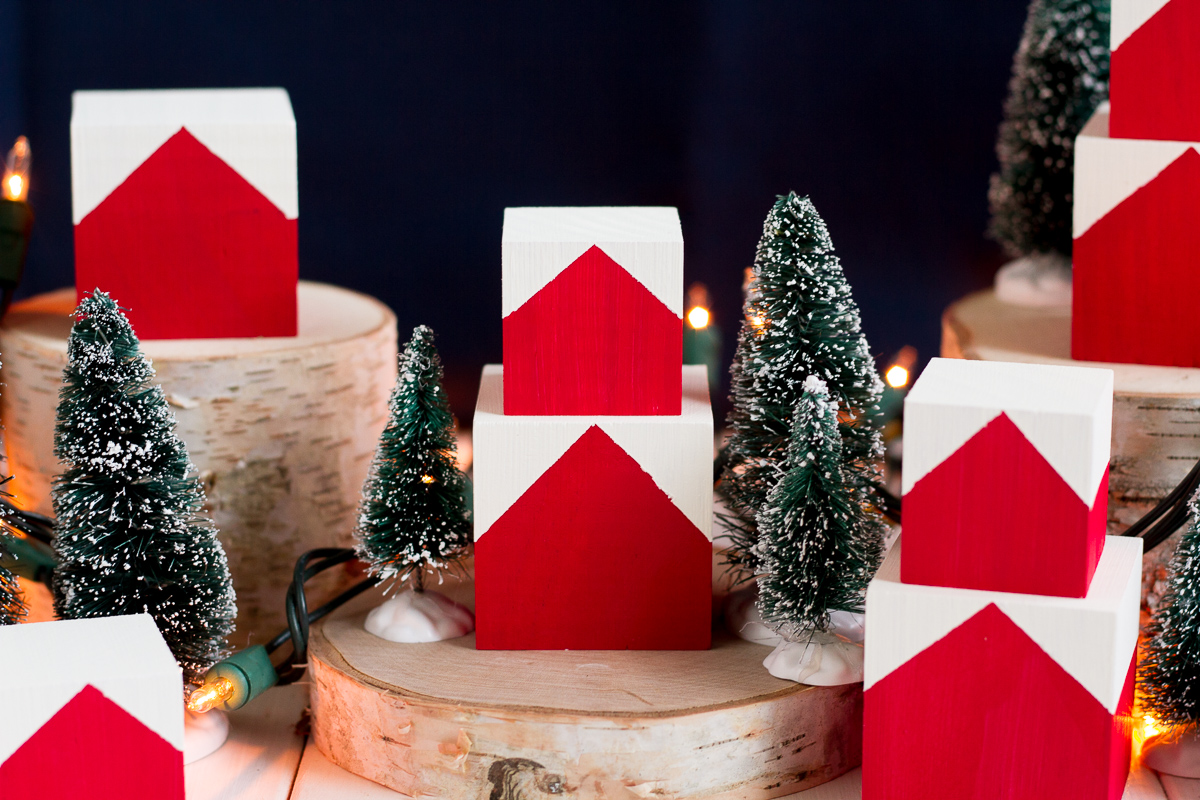 These cute and easy DIY Norwegian Christmas House blocks are inspired by the red and white houses tucked into the hillsides of fjord country.