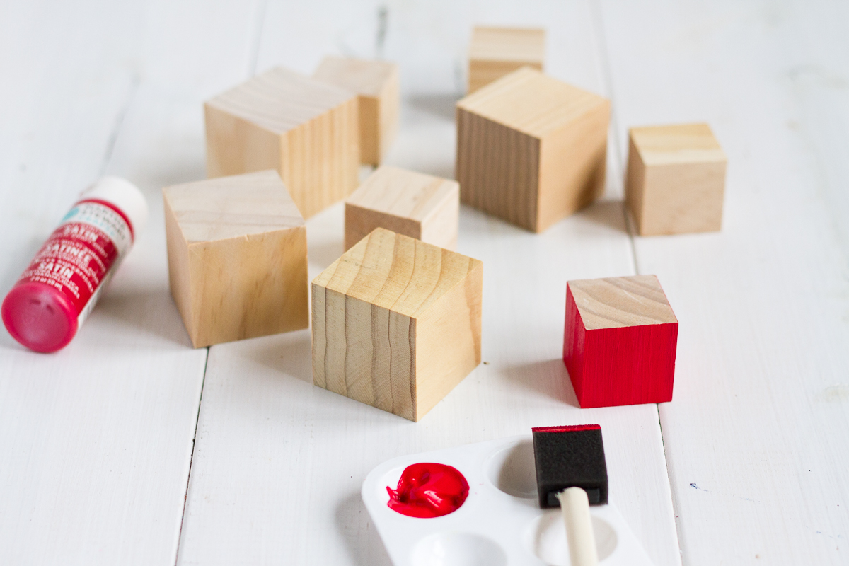 These cute and easy DIY Norwegian Christmas House blocks are inspired by the red and white houses tucked into the hillsides of fjord country.