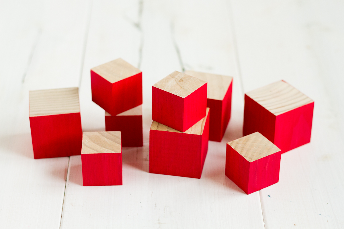 These cute and easy DIY Norwegian Christmas House blocks are inspired by the red and white houses tucked into the hillsides of fjord country.