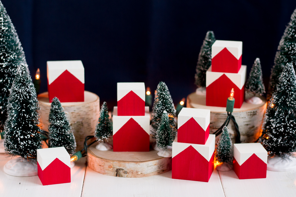 These cute and easy DIY Norwegian Christmas House blocks are inspired by the red and white houses tucked into the hillsides of fjord country.