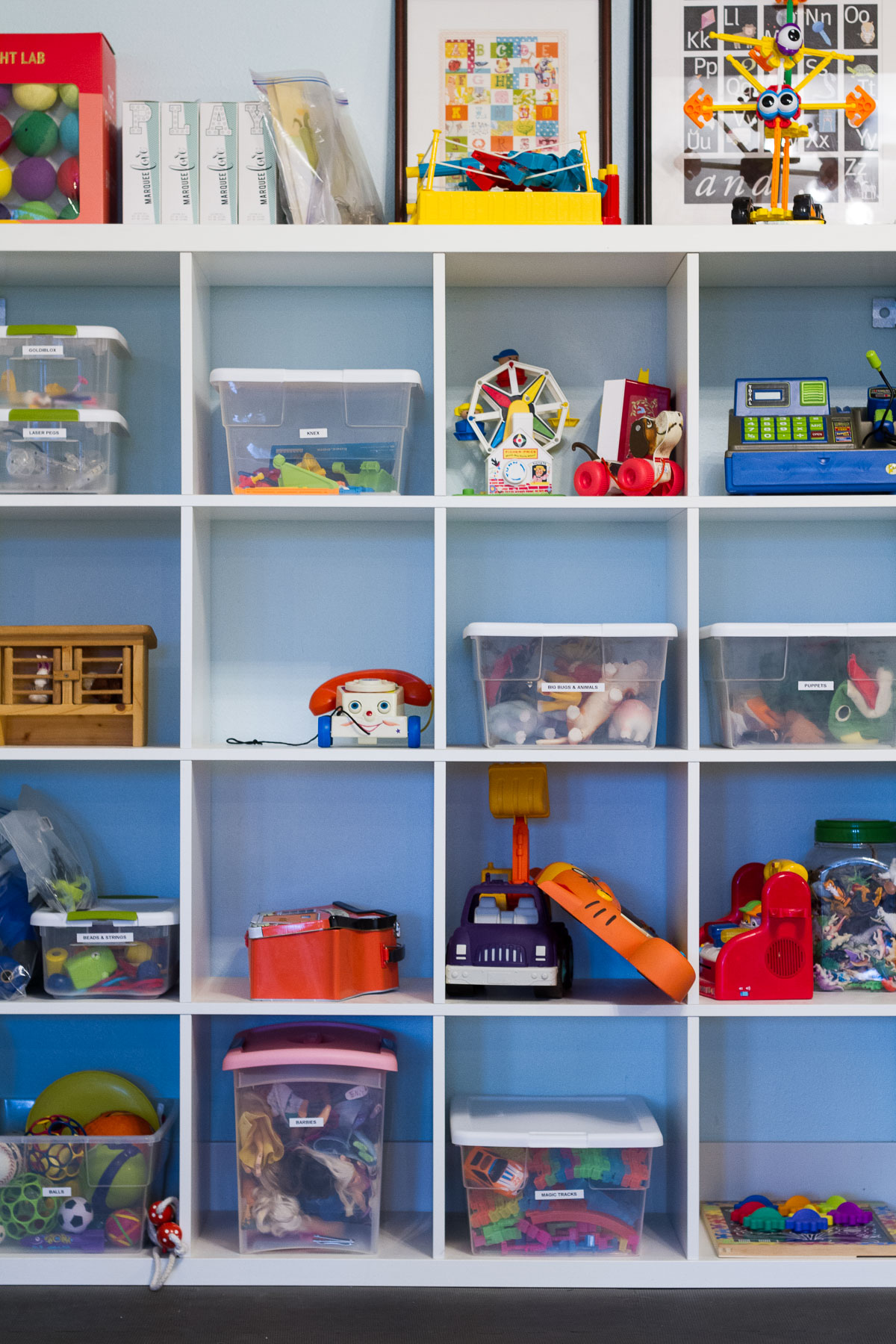 We cleaned and reorganized our playroom over the holidays, thanks to the Dymo Letratag label maker. Two weeks in and the room is still spotless!