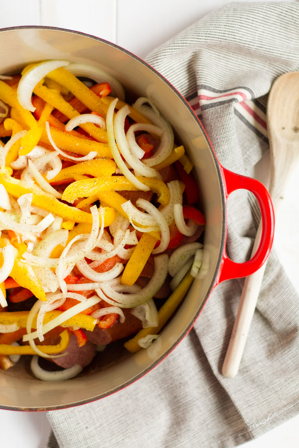 Tomato -braised sausage sandwiches with onions and peppers