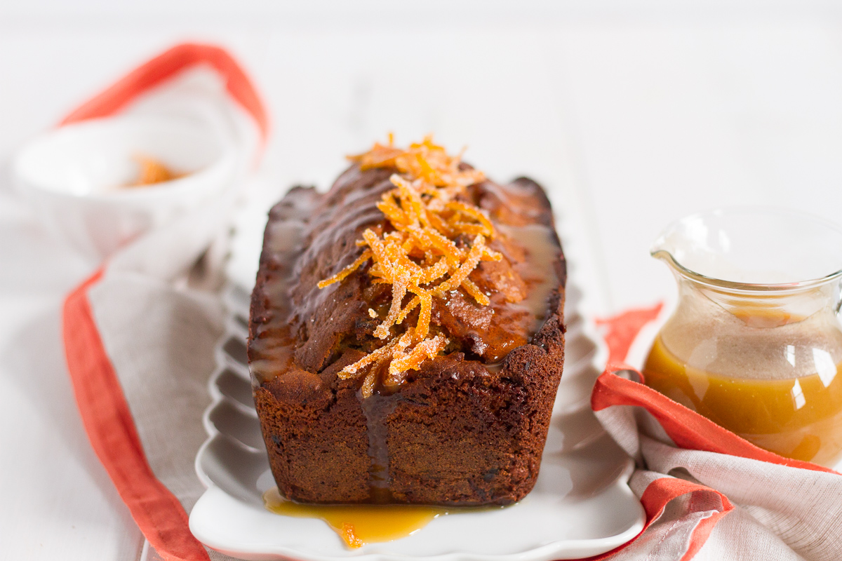a delightful orange cake filled with dates and walnuts, and topped with a luxurious orange butterscotch sauce