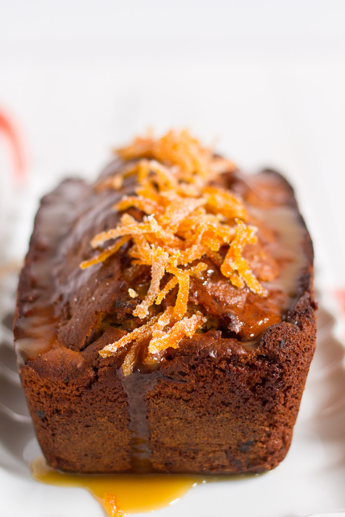 a delightful orange cake filled with dates and walnuts, and topped with a luxurious orange butterscotch sauce