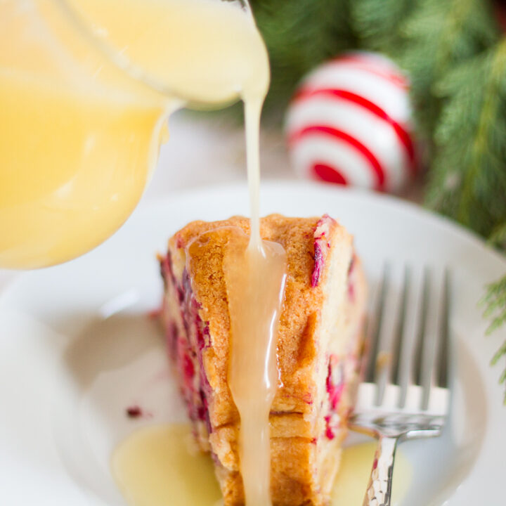 This fresh cranberry cake with hot butter sauce is simple and delicious. It is a breeze to make, but it looks beautiful and tastes luxurious. All of those things combine to make it the perfect dessert to serve to guests during the holidays.