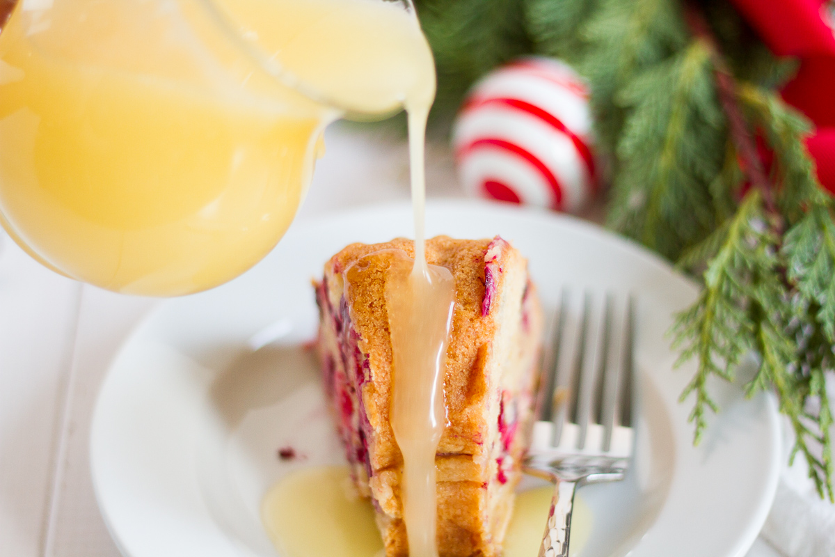 This fresh cranberry cake with hot butter sauce is simple and delicious. It is a breeze to make, but it looks beautiful and tastes luxurious. All of those things combine to make it the perfect dessert to serve to guests during the holidays.