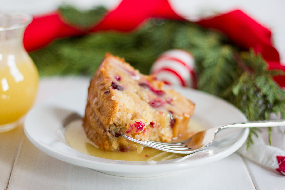 This fresh cranberry cake with hot butter sauce is simple and delicious. It is a breeze to make, but it looks beautiful and tastes luxurious. All of those things combine to make it the perfect dessert to serve to guests during the holidays.