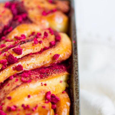 A classic brioche dough with raspberry swirled throughout, topped with a sticky sugar syrup and crushed, freeze-dried raspberries