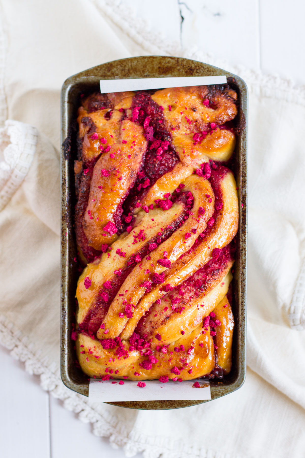 A classic brioche dough with raspberry swirled throughout, topped with a sticky sugar syrup and crushed, freeze-dried raspberries