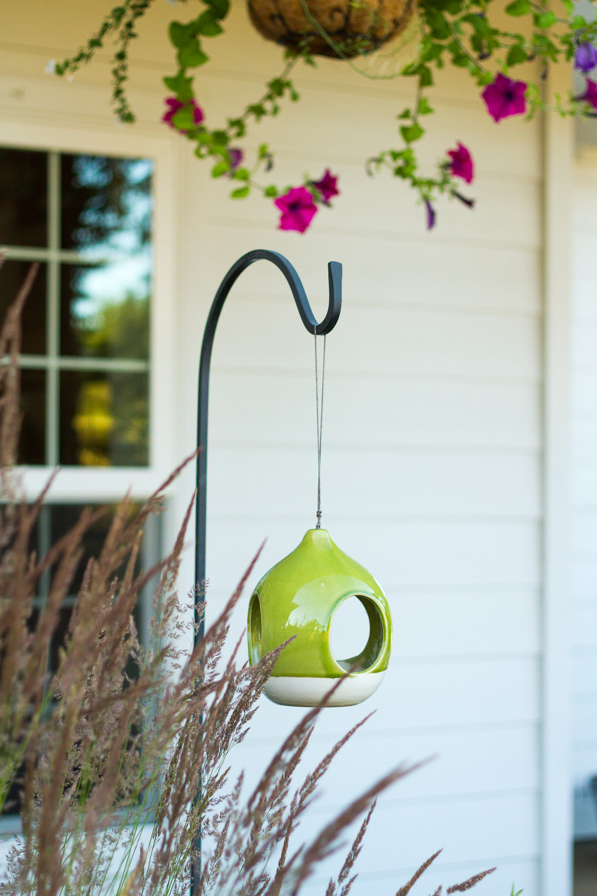 clay bird feeder in front yard landscape design