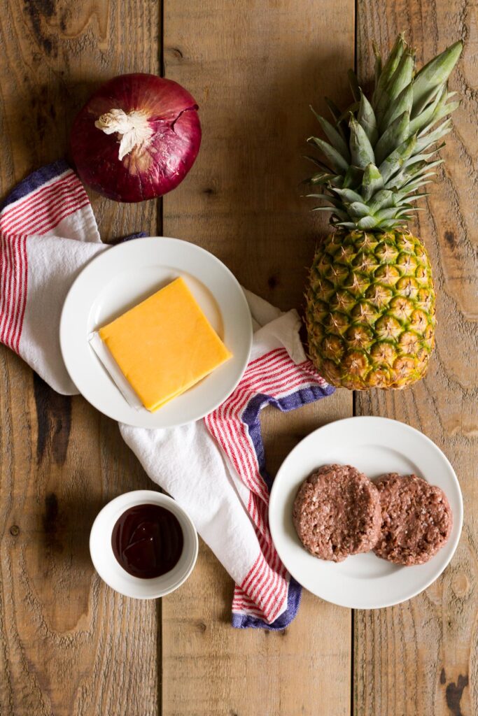 red onion, pineapple, cheddar, bbq sauce, and patties for tropical bbq burgers
