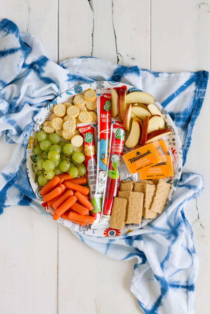 A snack tray loaded up with your favorite snacks makes a perfect summer lunch for the whole family.